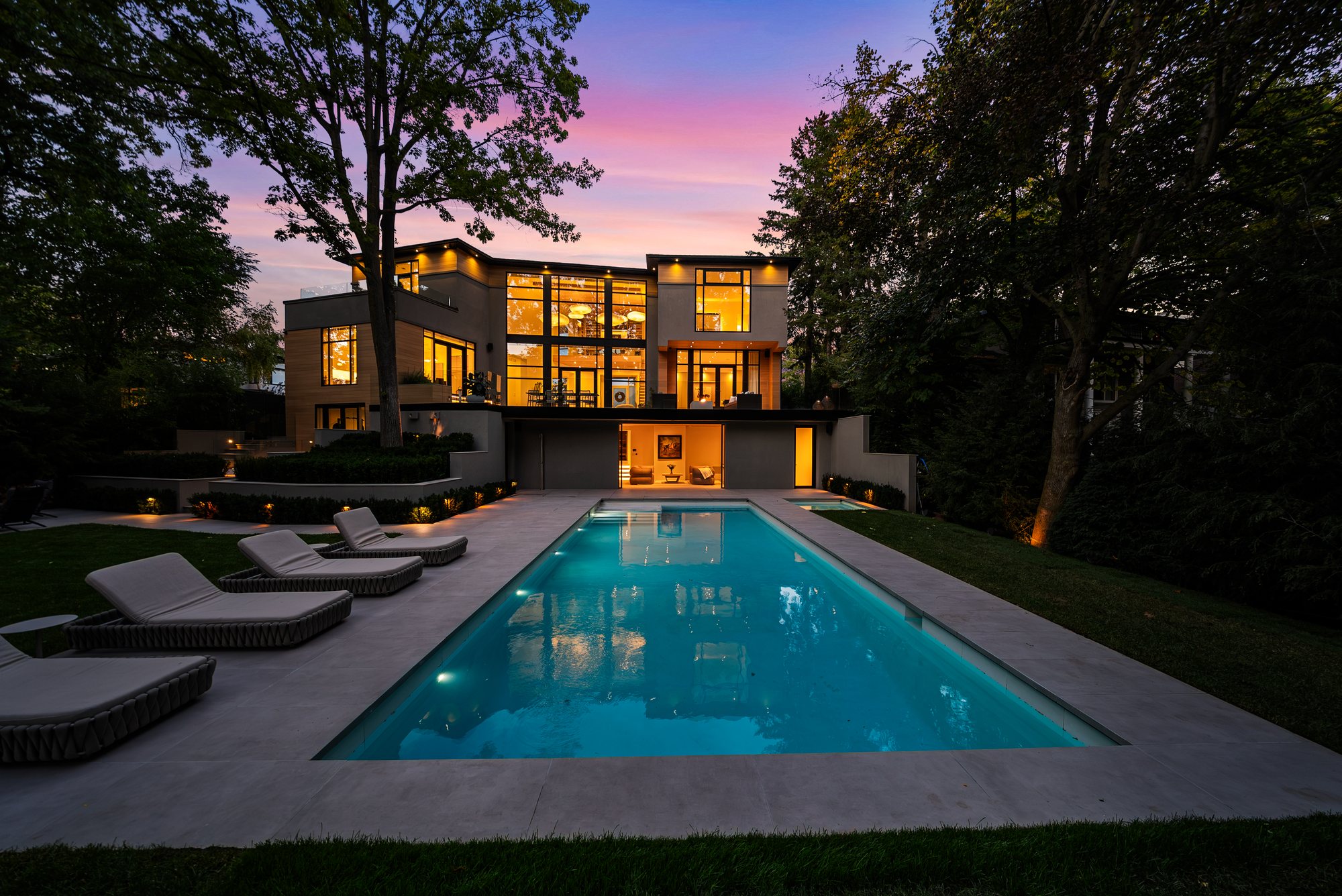 Pool and outdoor living area at dusk